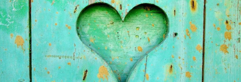 Heart cut out in wood painted light green